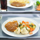 Illustration for article titled Indiana school repurposes cafeteria leftovers into weekend meals for students